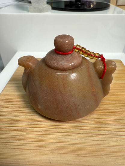 Golden Jasper crystal teapot figurine with warm honey-brown tones and earthy patterns, 2 inches long, shown as elegant decor.