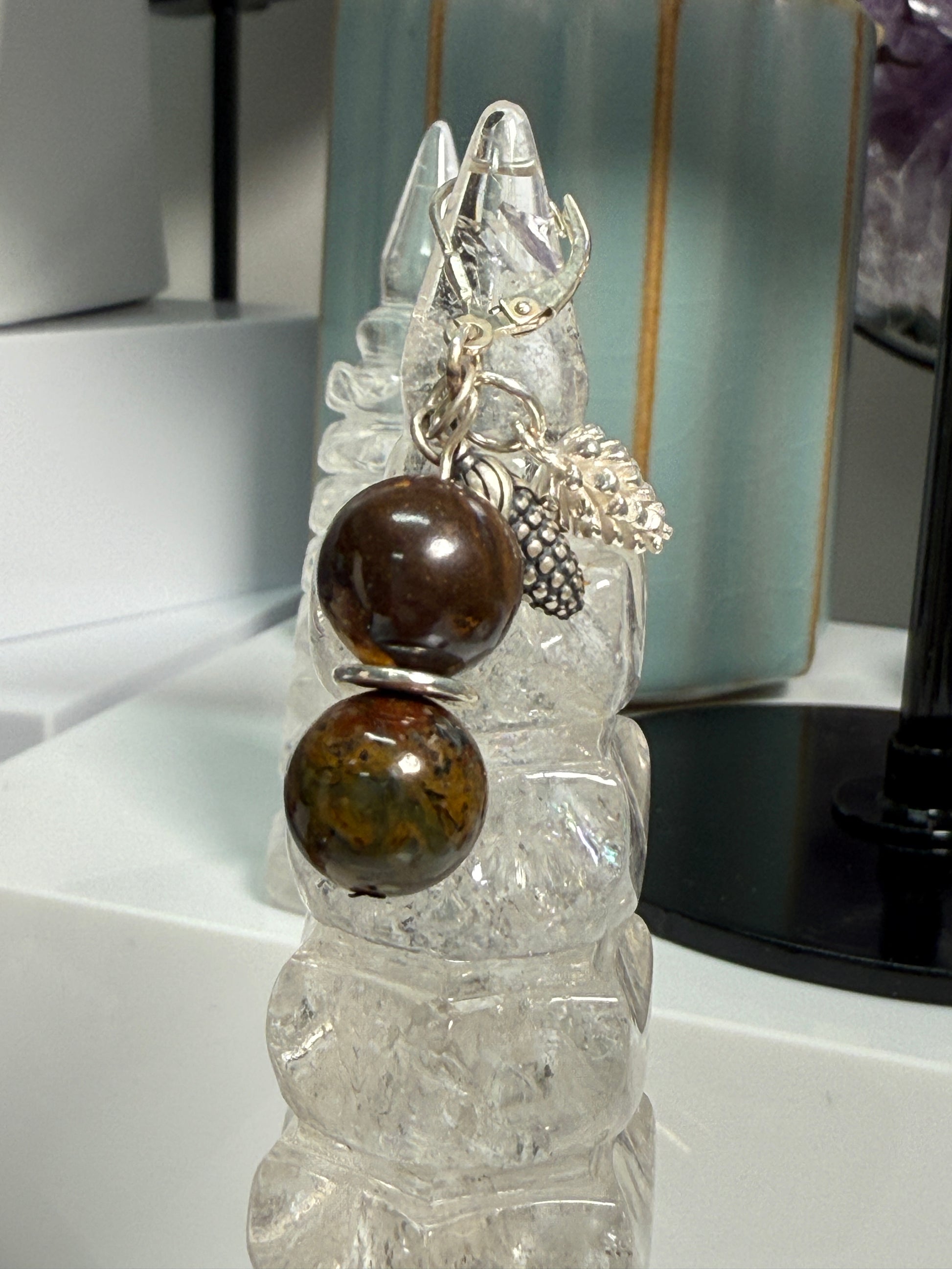 Earrings with round Brown Opal and Pietersite stones, finished with detailed silver pine cone and corn cob motifs. Styled as earthy, fall-inspired jewelry.